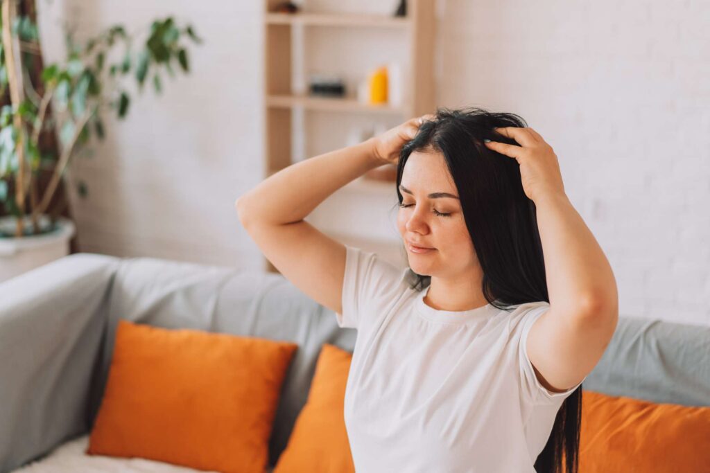Scalp massage with warm oil for healthy hair care